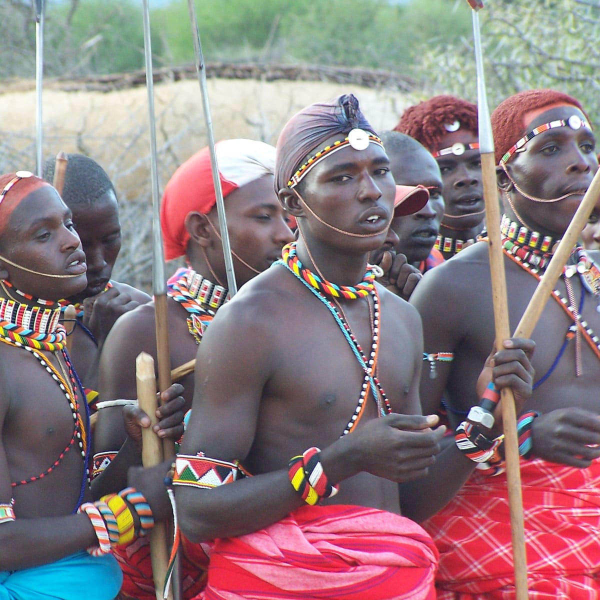 Male Samburu tribesmen in tradition red and blue clothing with woven accessories